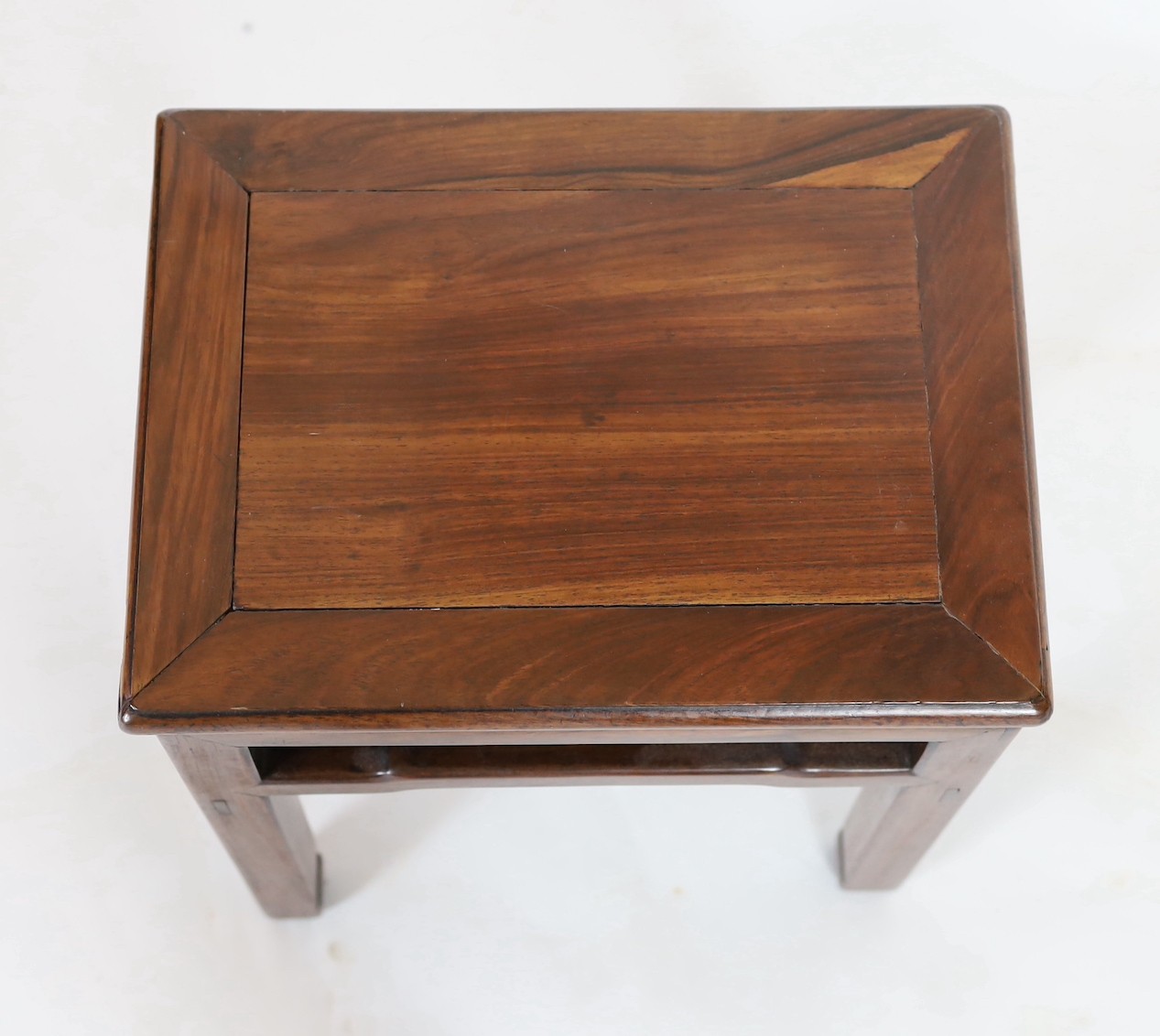 A Chinese huanghuali and hongmu stool, 18th/19th century, 40.5cm wide, 30.5cm deep, 50.5cm high